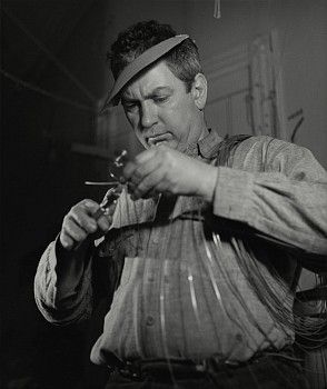 Herbert Matter - Alexander Calder in his New York City storefront studio, winter