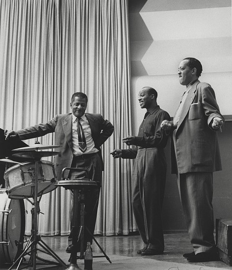 Herman Leonard, Teddy Wilson, Jo Jones, Lester Young, Paris, 1958
Gelatin silver print; printed later, 12 x 10 in. (30.5 x 25.4 cm)
A charming, informal portrait of three jazz giants. Teddy Wilson (1912-1986), a pioneer, described as "the definitive swing pianist". Wilson's elegant style was recorded with many of the biggest names in jazz. Jo Jones (1911-1985) was a legendary drummer, band leader, and percussion pioneer. He also played with Count Basie, from 1934 to 1948. Lester "Prez" Young (1909-1959), a tenor saxophonist who became prominent with Count Basie's orchestra. He was one of the most influential players on the tenor, with a relaxed, cool tone and sophisticated harmonies. Signed by the photographer. Framed.
7409
$2,400